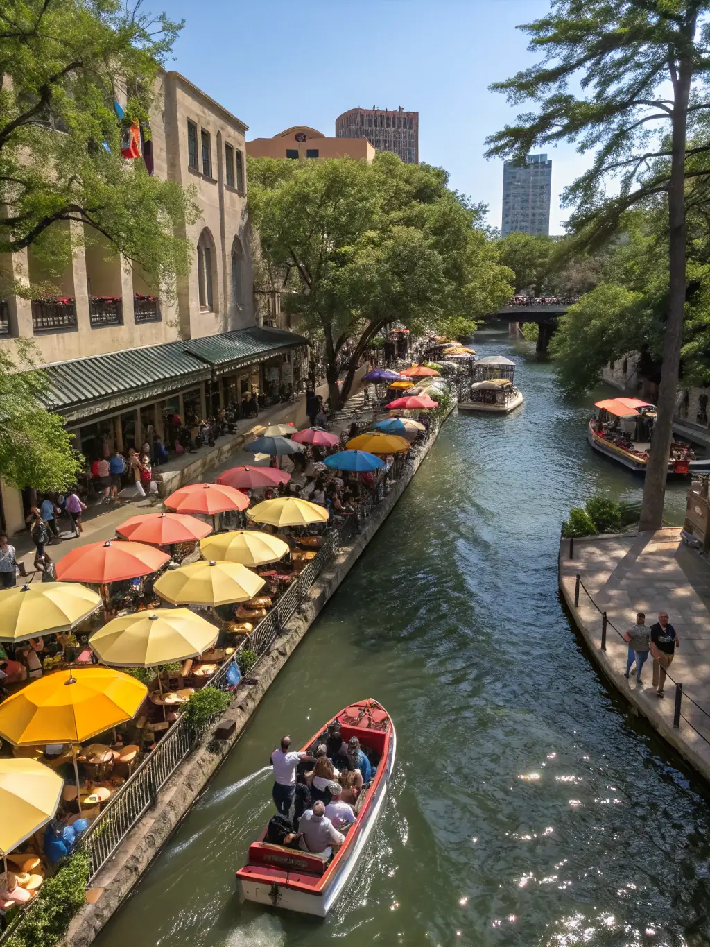 A photograph of San Antonio, Texas, focusing on the Riverwalk and surrounding areas, emphasizing the city's unique environment and potential for tourism-related injuries. The image should reflect Injury Defense Texas's dedication to the San Antonio community.